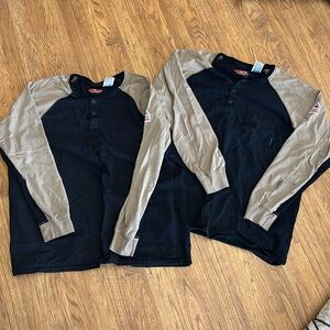 Two identical flame resistant long sleeved work shirts